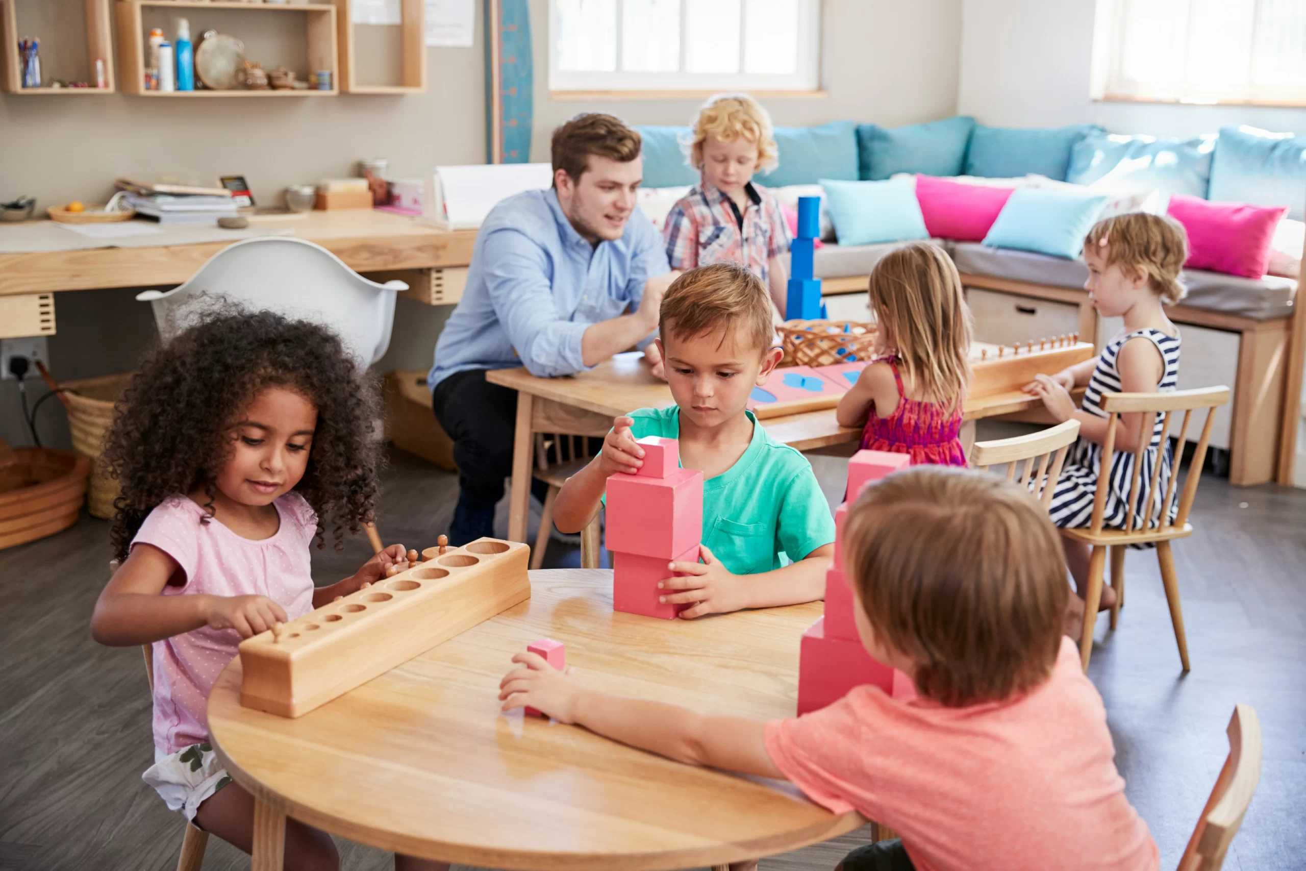 Children working independently with Montessori materials in a bright classroom